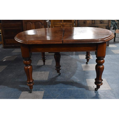 483 - A Late Victorian Mahogany Pull Out Dining Table having Three Extra Leaves Extending to 344cms by 120... 