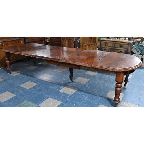 483 - A Late Victorian Mahogany Pull Out Dining Table having Three Extra Leaves Extending to 344cms by 120... 