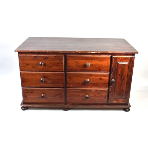 491 - A Stained Pine Sideboard having Two Banks of Three Shirt Drawers and Side Cupboard, 132cms Wide