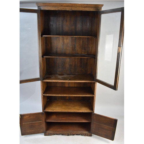 503 - An Early/Mid 20th Century Oak Glazed Bookcase with Cupboard Base and Centre Open Section, 76cms Wide