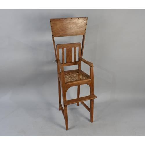 504 - A Mid 20th Century Cane Seated Child's Highchair with Hinged Tray