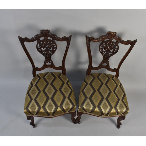 510 - A Pair of Edwardian Carved and Pierced Ladies Nursing Chairs with Short Cabriole Front Supports