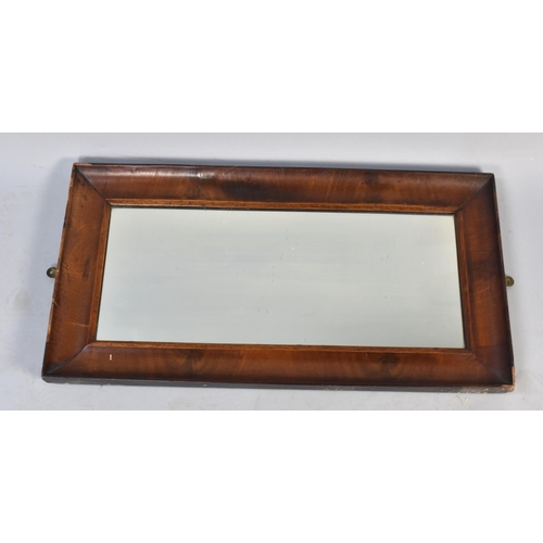 519 - A 19th Century Mahogany Framed Rectangular Wall Mirror, 77cms by 40cms