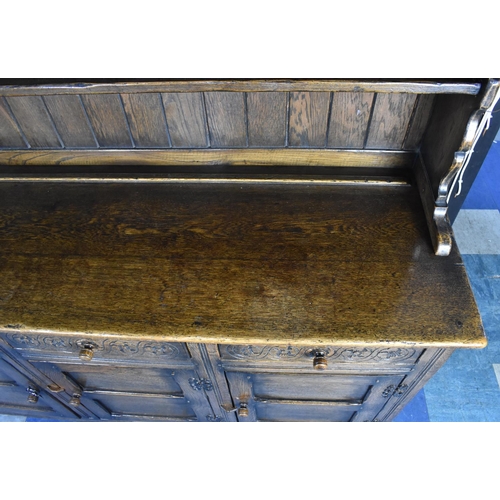 520 - A Mid 20th Century Oak Dresser, the Base with Three Drawers over Panelled Doors to Cupboard, Raised ... 