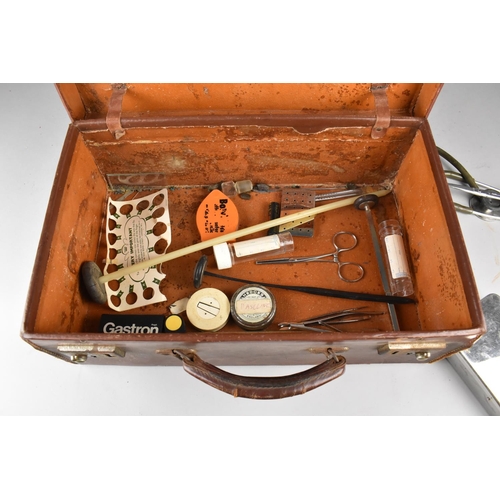 54 - A Vintage Leather Case Containing Vintage Doctors Equipment to include Stethoscope, Scissors etc tog... 