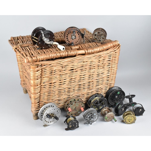 A Wicker Fishing Creel Containing Various Vintage Reels to include Bakelite  Cased Penn No 78, Small