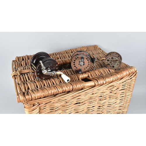 A Wicker Fishing Creel Containing Various Vintage Reels to include Bakelite  Cased Penn No 78, Small
