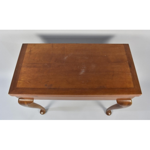 94 - A Mahogany Games Table on Cabriole Supports Culminating to Pad Feet, 77.5cms High by 81cms Wide