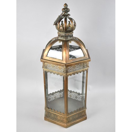 79 - A Reproduction Hexagonal Bronzed Metal and Glazed Lantern, 63cms High