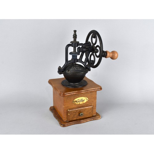 177 - A Cast Iron and Wooden Base Coffee Grinder