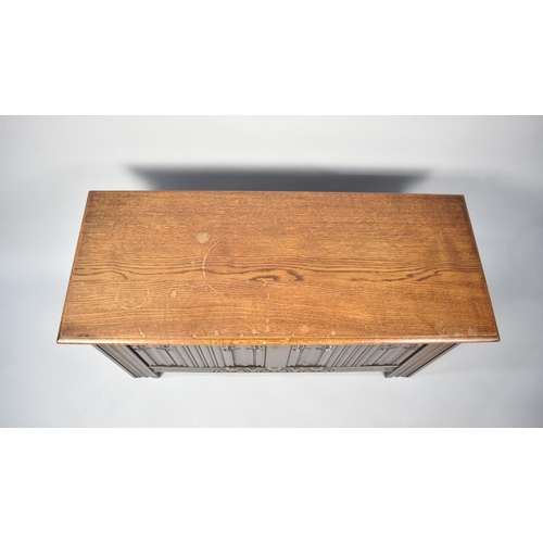 244 - A Mid 20th Century Oak Linen Fold Lift Top Coffer, 99cms Wide