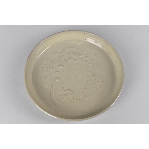 268 - A Chinese Celadon Brush Washer/Dish Decorated in Shallow Relief with Phoenix and Lotus, 22cm diamete... 