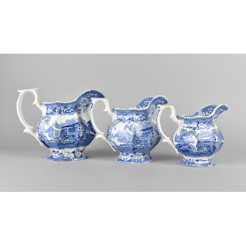 400 - A Set of Three Graduated Blue and White Jugs by T Hughes & Son, Longport, Swiss Pastimes, Tallest 17... 