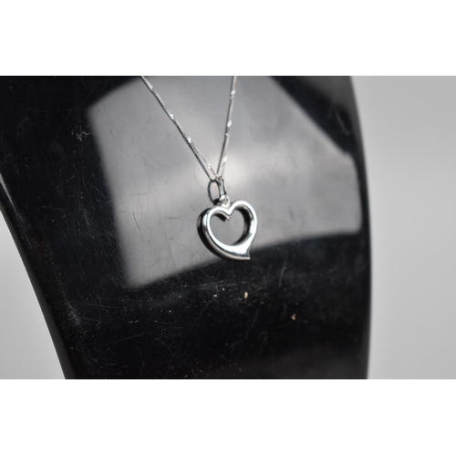 439 - A 9ct White Gold Heart Shaped Pendant on Chain, 1.7gms