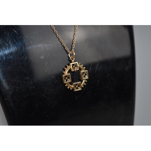 441 - A Victorian 9ct Gold Pendant on Chain, Circular Spoked Form, 1.7gms