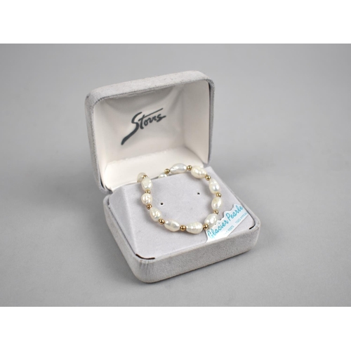 458 - A 9ct Gold and Pearl Bracelet