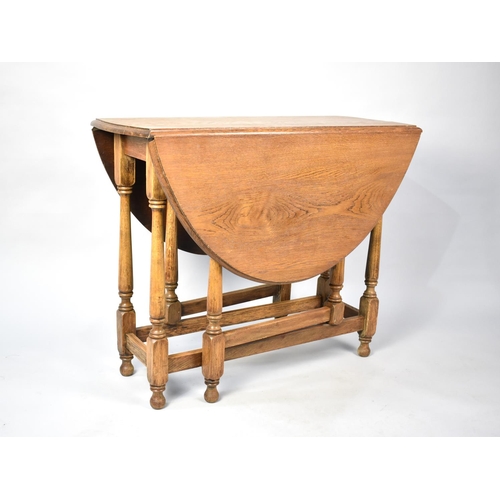 509 - A Mid 20th Century Oak Drop Leaf Gate Leg Table, 90cms Wide