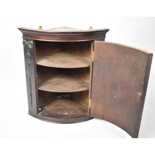 86 - An Edwardian Mahogany Bow Fronted Wall Hanging Small Corner Cabinet with Molded Ribbon and Swag Deco... 