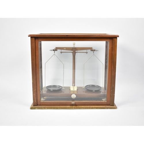 124 - A Vintage Scientific Pan Scale in Glazed Mahogany Case, Complete with a Set of Baird and Tatlock Wei... 