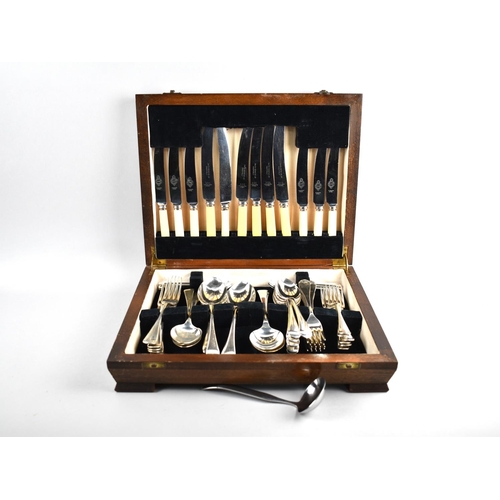 137 - A Mid 20th Century Oak Cased Canteen Containing Mixed Cutlery