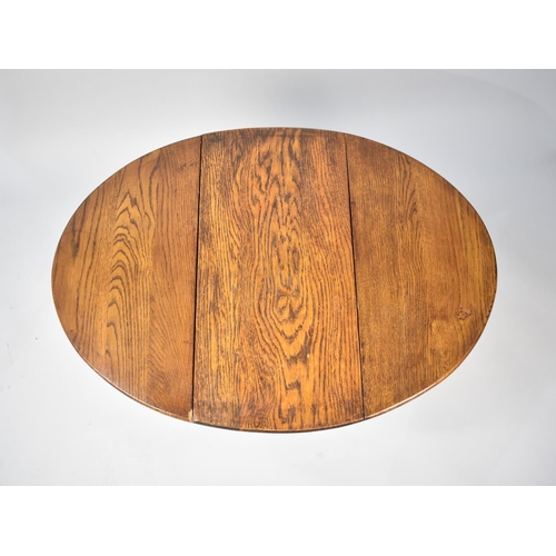 144 - A Mid 20th Century Oak Drop Leaf Circular Coffee Table on Pierced Supports, 53cms Wide