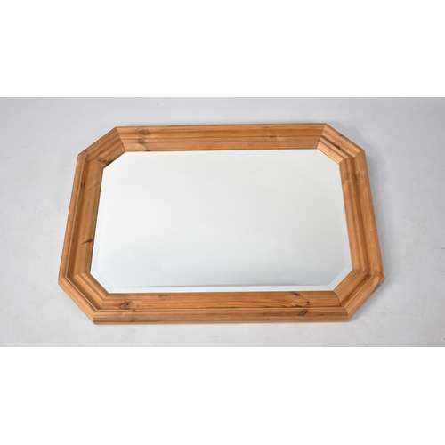 194 - A Modern Rectangular Wall Hanging Pine Framed Mirror with Bevelled Glass, 92x66cms