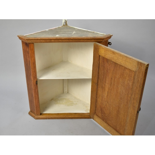 221 - A Mid 20th Century Oak Wall Hanging Small Corner Cupboard, 50cms Wide and 53cms High