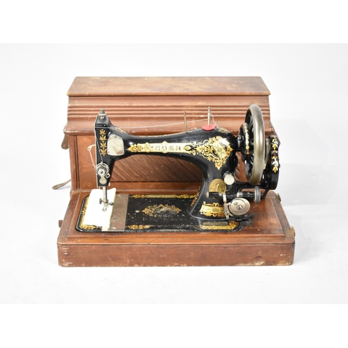 231 - A Vintage Cased Manual Singer Sewing Machine