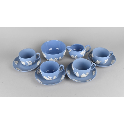 272 - Four Wedgwood Blue Jasperware Cups and Saucers Together with a Milk Jug and Sugar Bowl