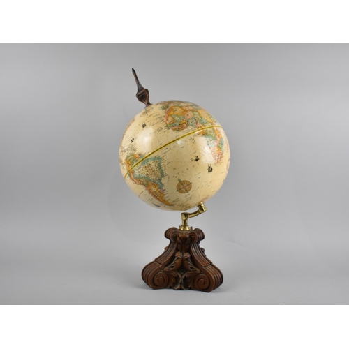 65 - A Modern Replogle American Table Top Globe on Carved Scrolled Wooden Stand, 45.5cms High