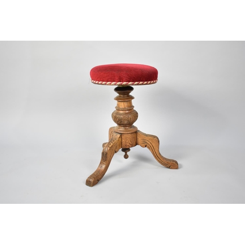 86 - A Late Victorian/Edwardian Swivel Top Piano Stool on Carved Wooden Tripod Base