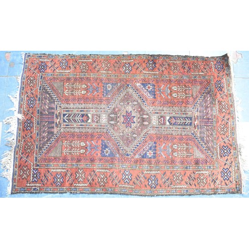 597 - An Antique Persian Patterned Rug, 140x88cms