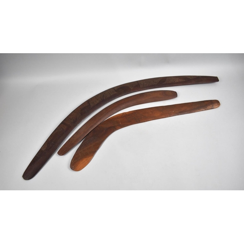 134 - A Set of Three Aboriginal Souvenir Boomerangs with Carved Decoration Depicting Game