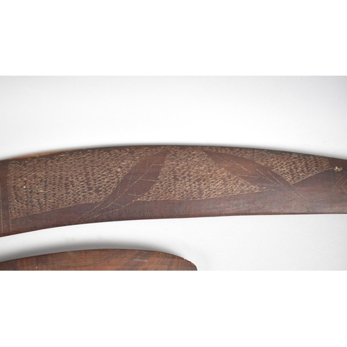 134 - A Set of Three Aboriginal Souvenir Boomerangs with Carved Decoration Depicting Game