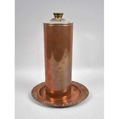 150 - A Vintage Cylindrical Copper Bottle with Screw Off Brass Cap, 30cms High together with a Copper Plat... 