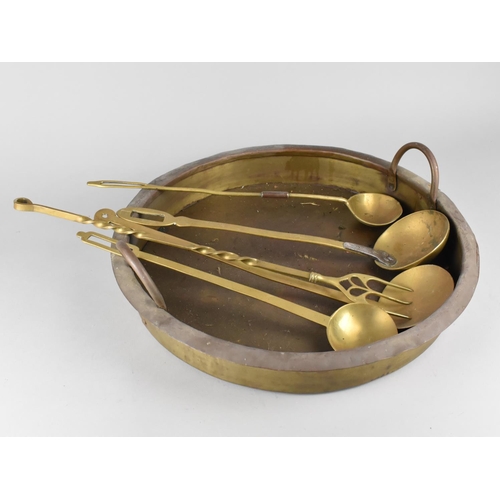 192 - A Large Shallow Circular Two Handled Cooking Pot together with Various Brass Ladles and Toasting For... 