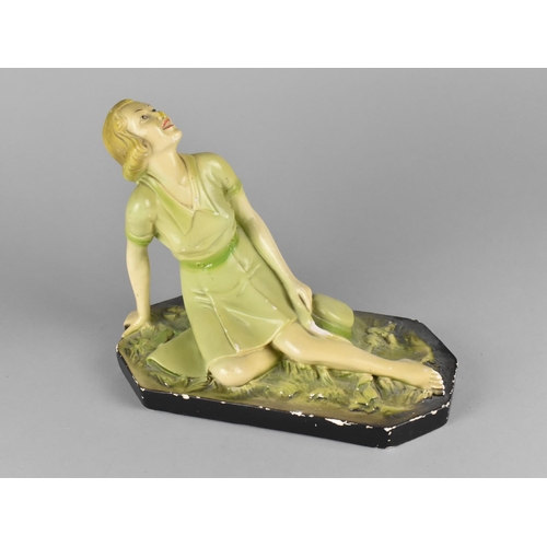 254 - A 1950s Cold Painted Plaster Study of Reclining Female together with a Novelty Ceramic Money Box, Co... 