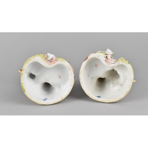 406 - A Pair of Continental Cold Painted Bisque Candlesticks decorated with Figures and Cats together with... 