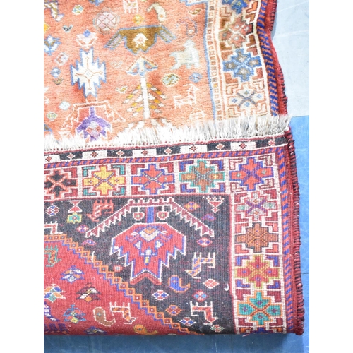 561 - A Vintage Patterned Woollen Rug, 155x113cms