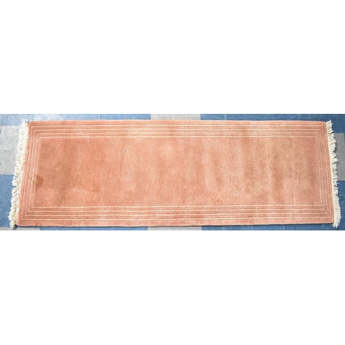 568 - A Short Woollen Runner on Pink Ground, 180x62cms