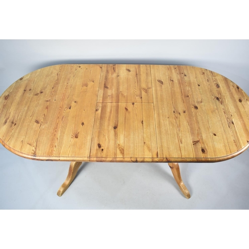 572 - An Extending Oval Pine Dining Table, 189cms by 91cms