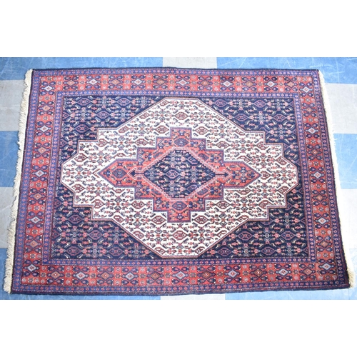 596 - A Patterned Woollen Rug, 160x117cms