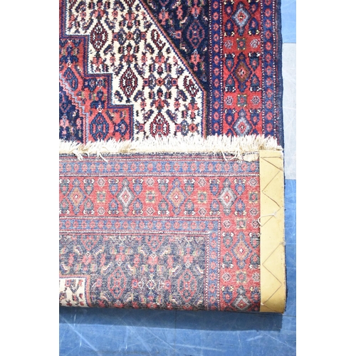 596 - A Patterned Woollen Rug, 160x117cms