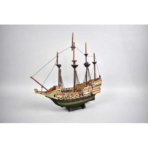 63 - A Sailor's Handmade and Painted Wooden Model of a Four Masted Tall Ship, 33cms Long