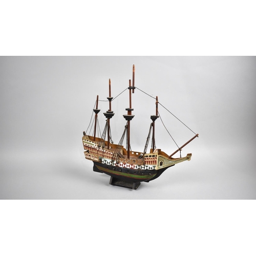 63 - A Sailor's Handmade and Painted Wooden Model of a Four Masted Tall Ship, 33cms Long