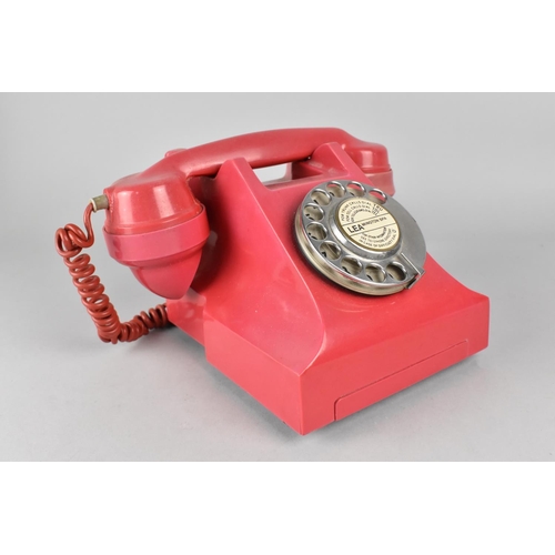 66 - A Vintage Red Bakelite Telephone, Somewhat Faded