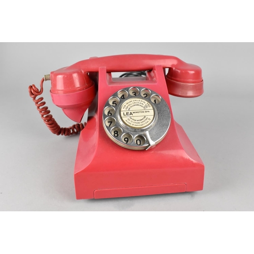 66 - A Vintage Red Bakelite Telephone, Somewhat Faded