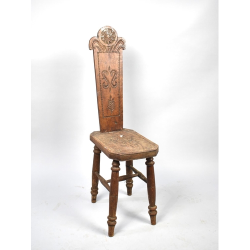 77 - An Early/Mid 20th Century Welsh Oak Spinning Chair with Carved Seat and Back