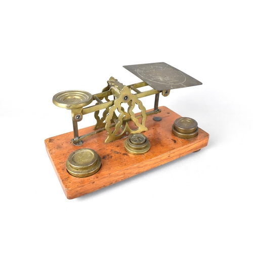 85 - An Edwardian Set of Brass Postage Scales with Weights on Rectangular Wooden Plinth Base, 21cms Wide