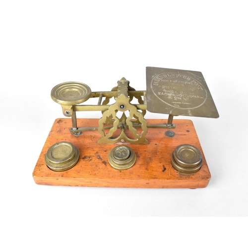 85 - An Edwardian Set of Brass Postage Scales with Weights on Rectangular Wooden Plinth Base, 21cms Wide